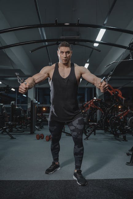 Bodybuilder performing cable chest flyes